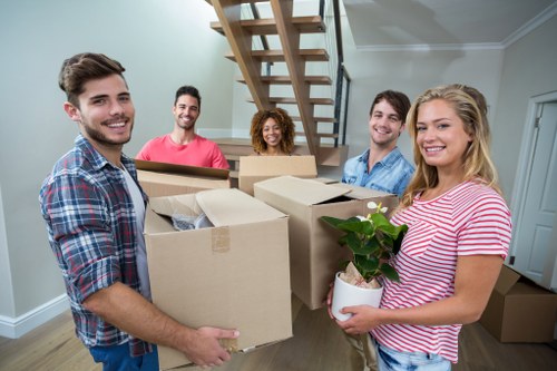 Loading furniture into a moving truck in Belgravia