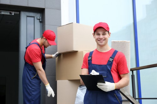 Moving service vehicle in Belgravia with careful handling of household items