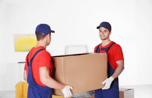 Careful loading of household belongings by a removal team in central London