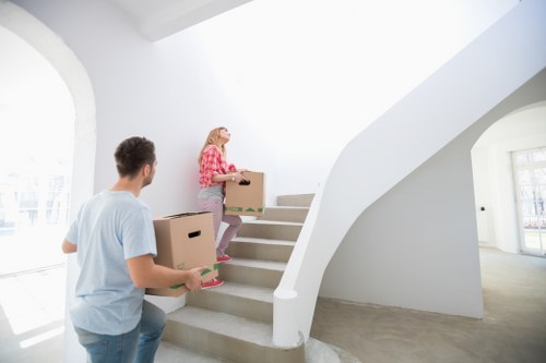 Professional movers packing boxes for a Belgravia home relocation