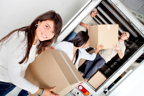 Moving crew handling furniture in Belgravia